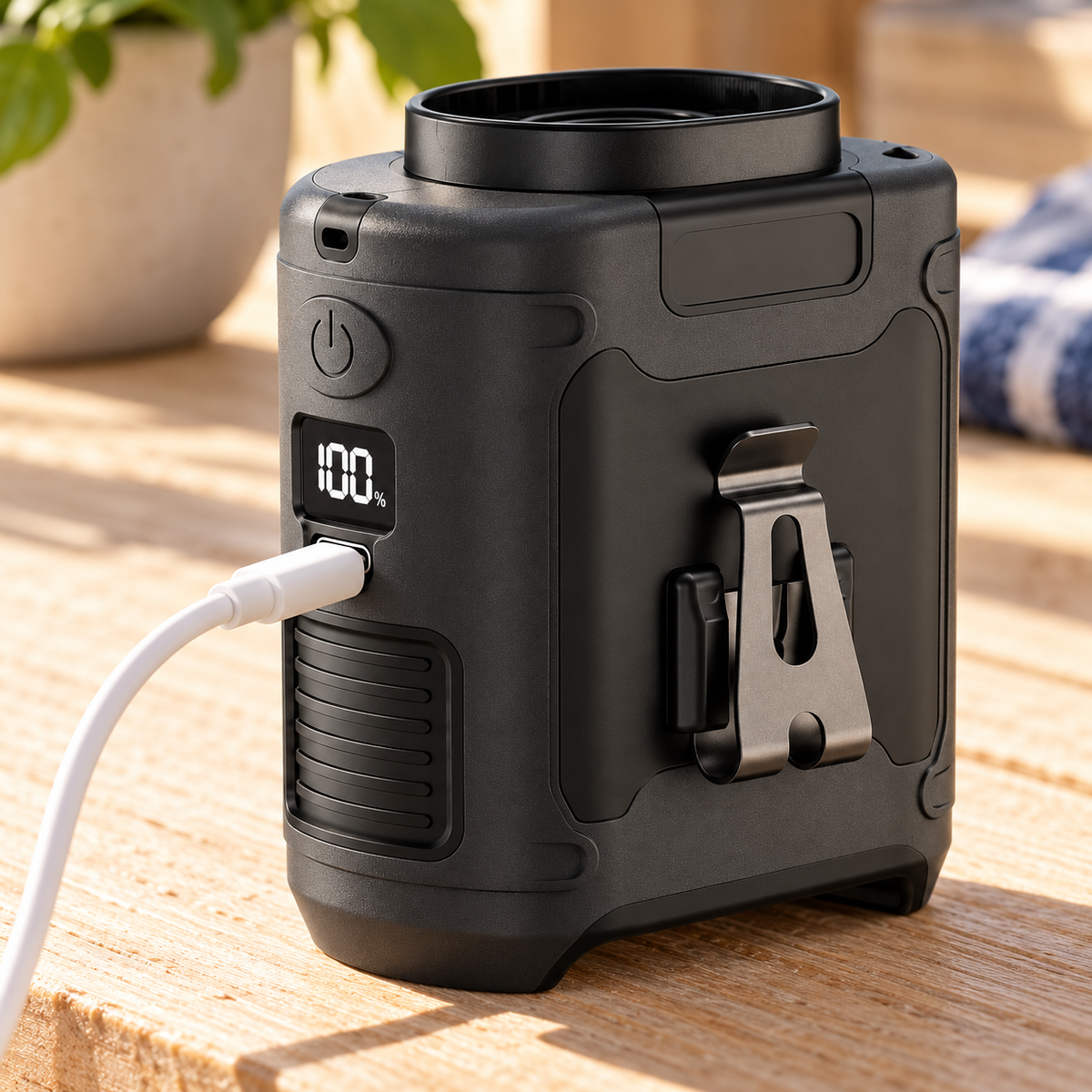 Black waist fan charging through its USB-C input